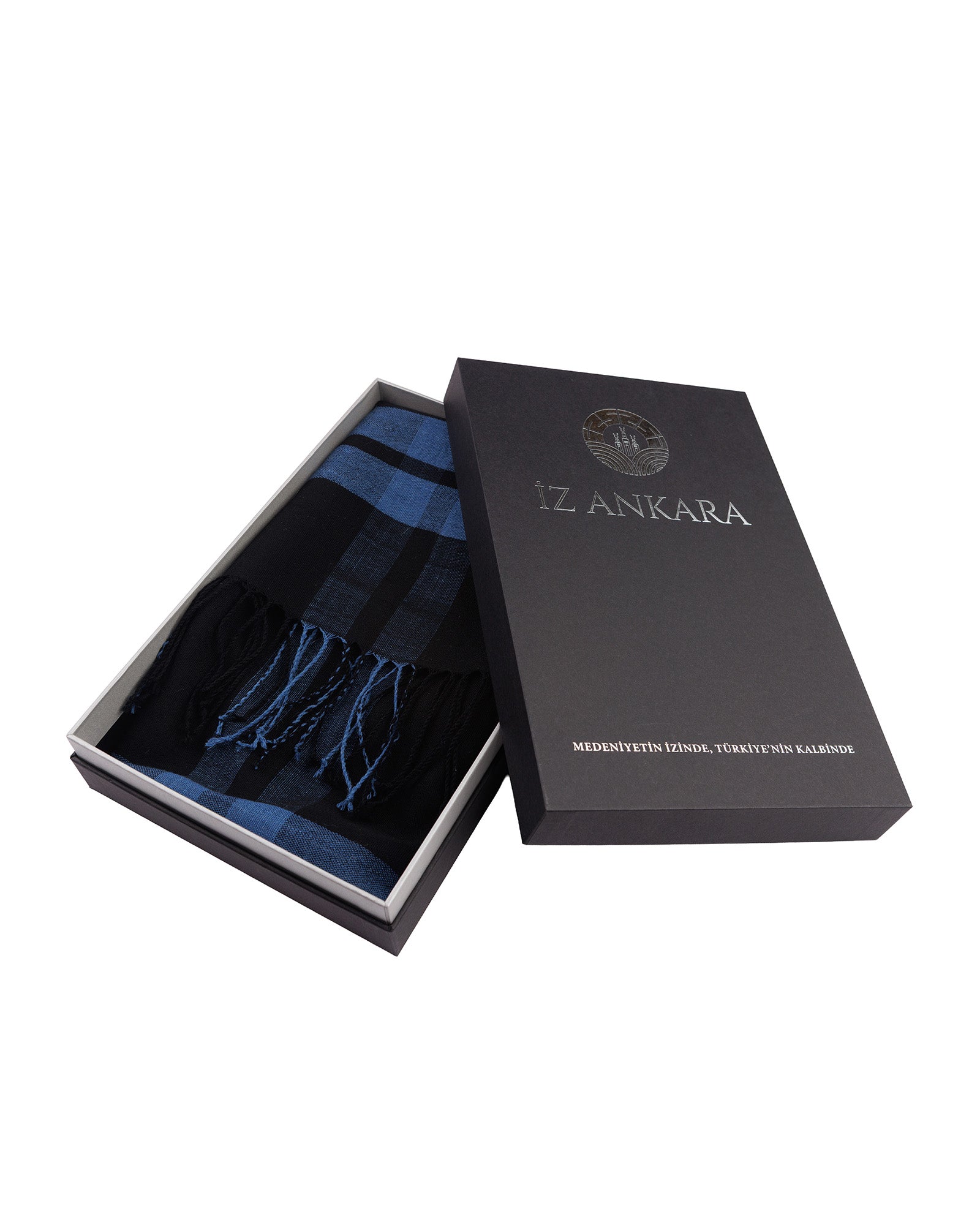 Blue scarf in an open black box with 'IZ ANKARA' branding on a white background