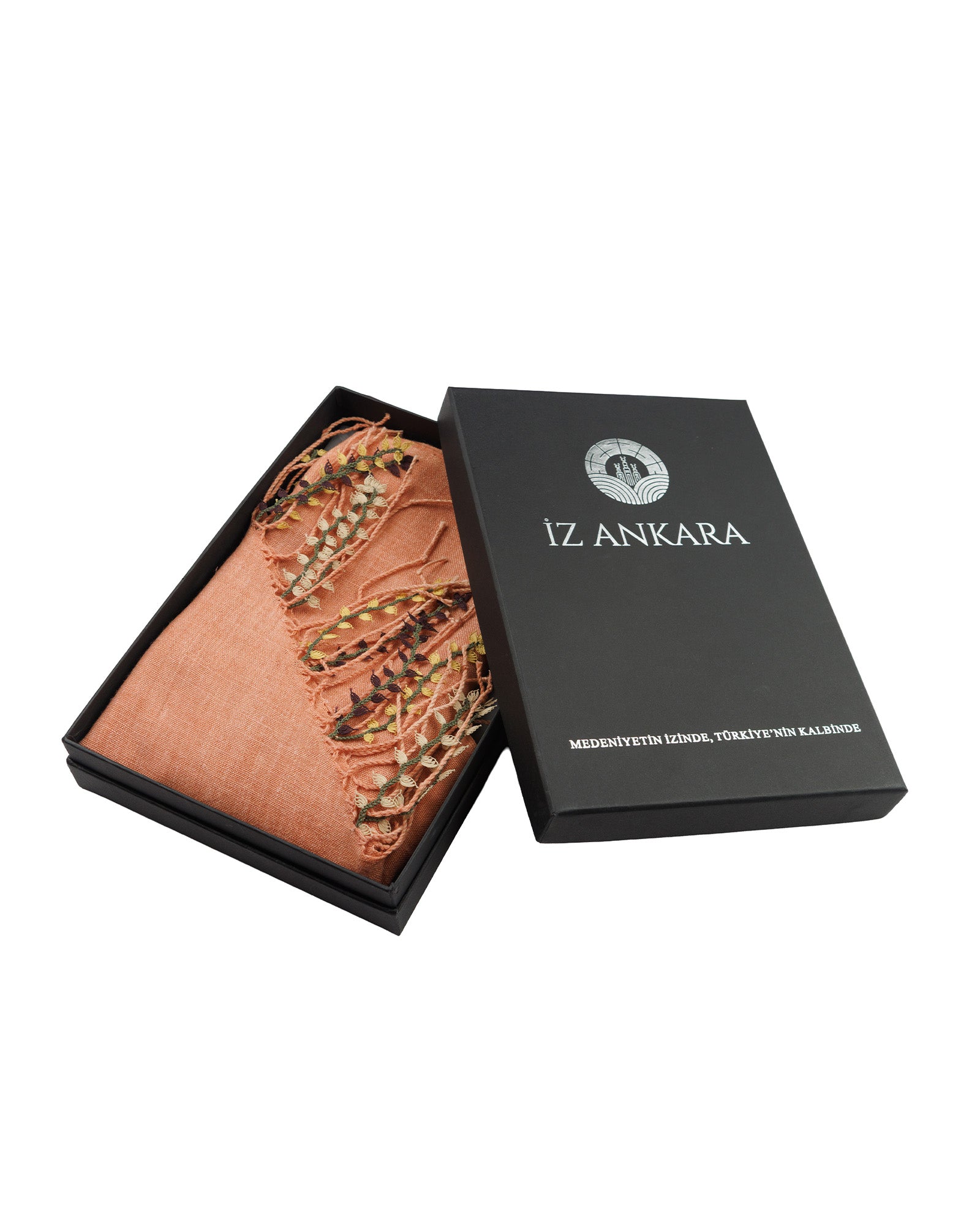 Open black box displaying a brown fabric item with 'IZ ANKARA' branding on a white background.