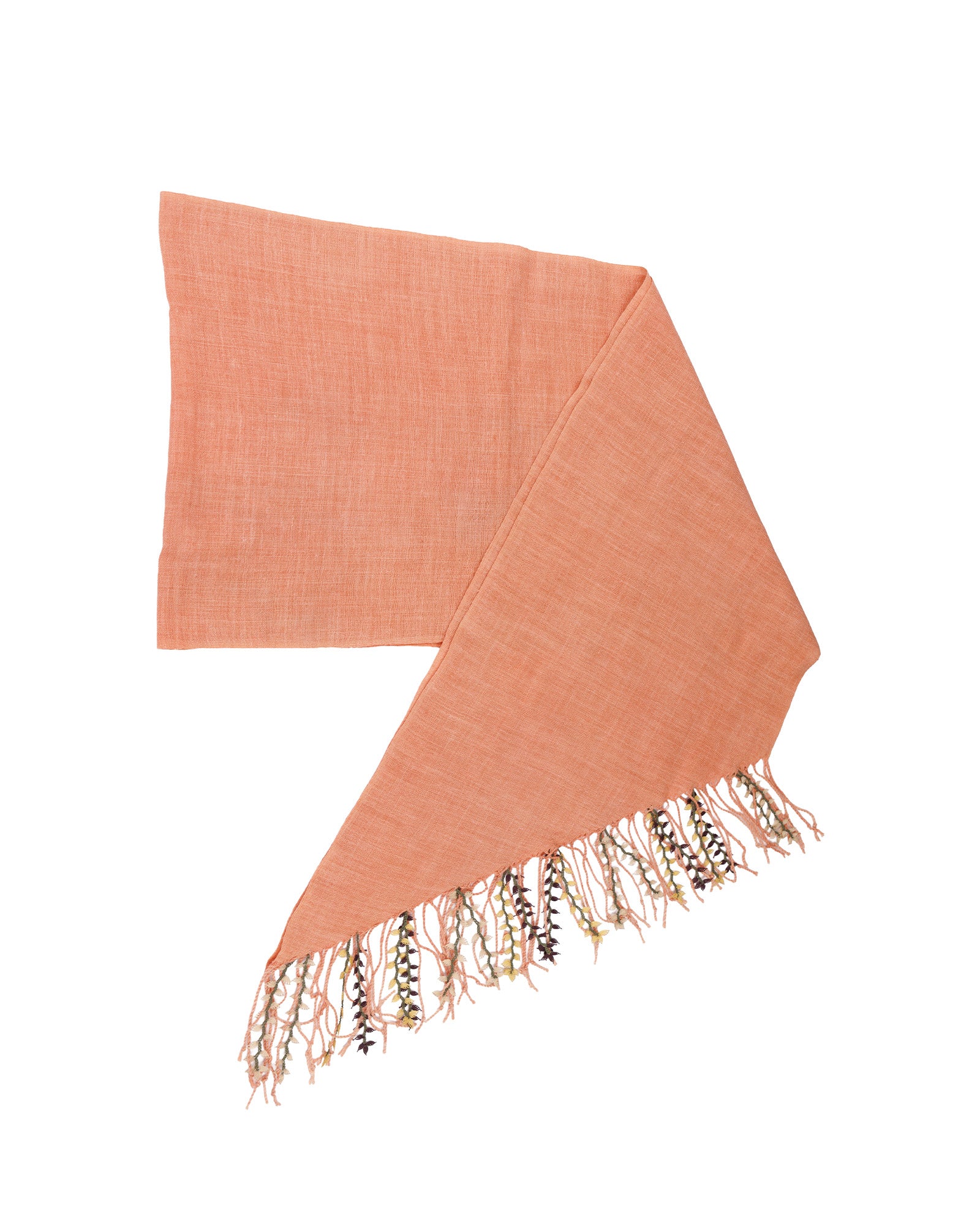 Peach-colored scarf with fringes on a white background