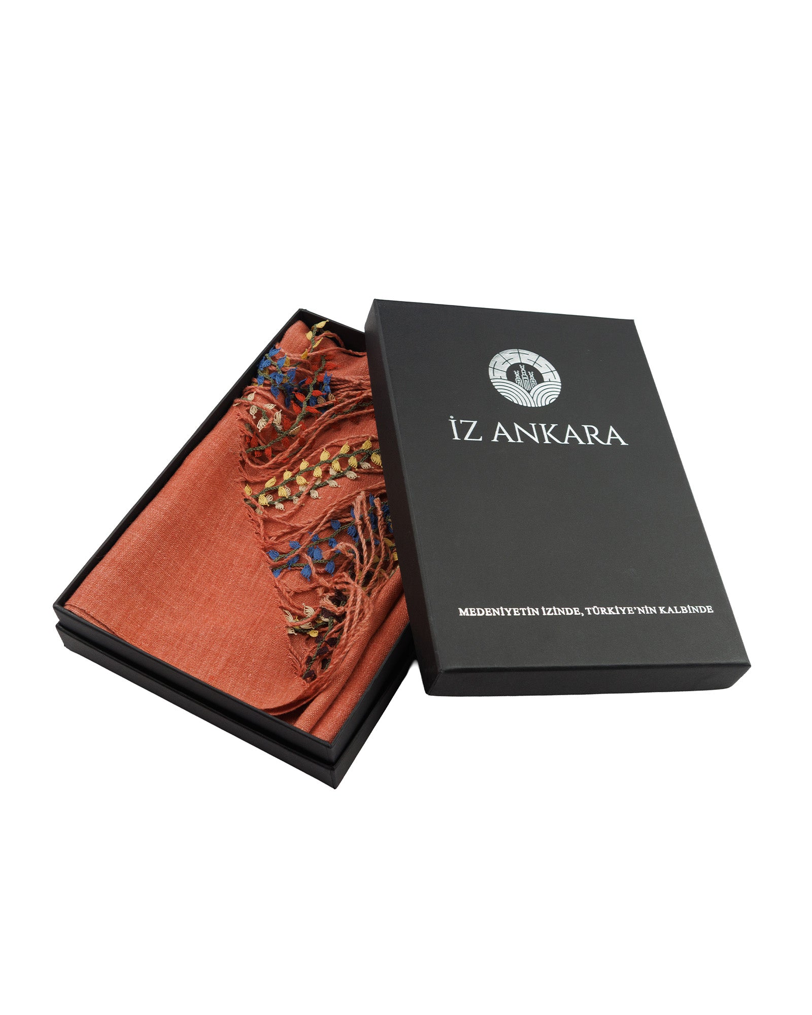 Orange scarf with tassels in a black 'Iz Ankara' box on a white background