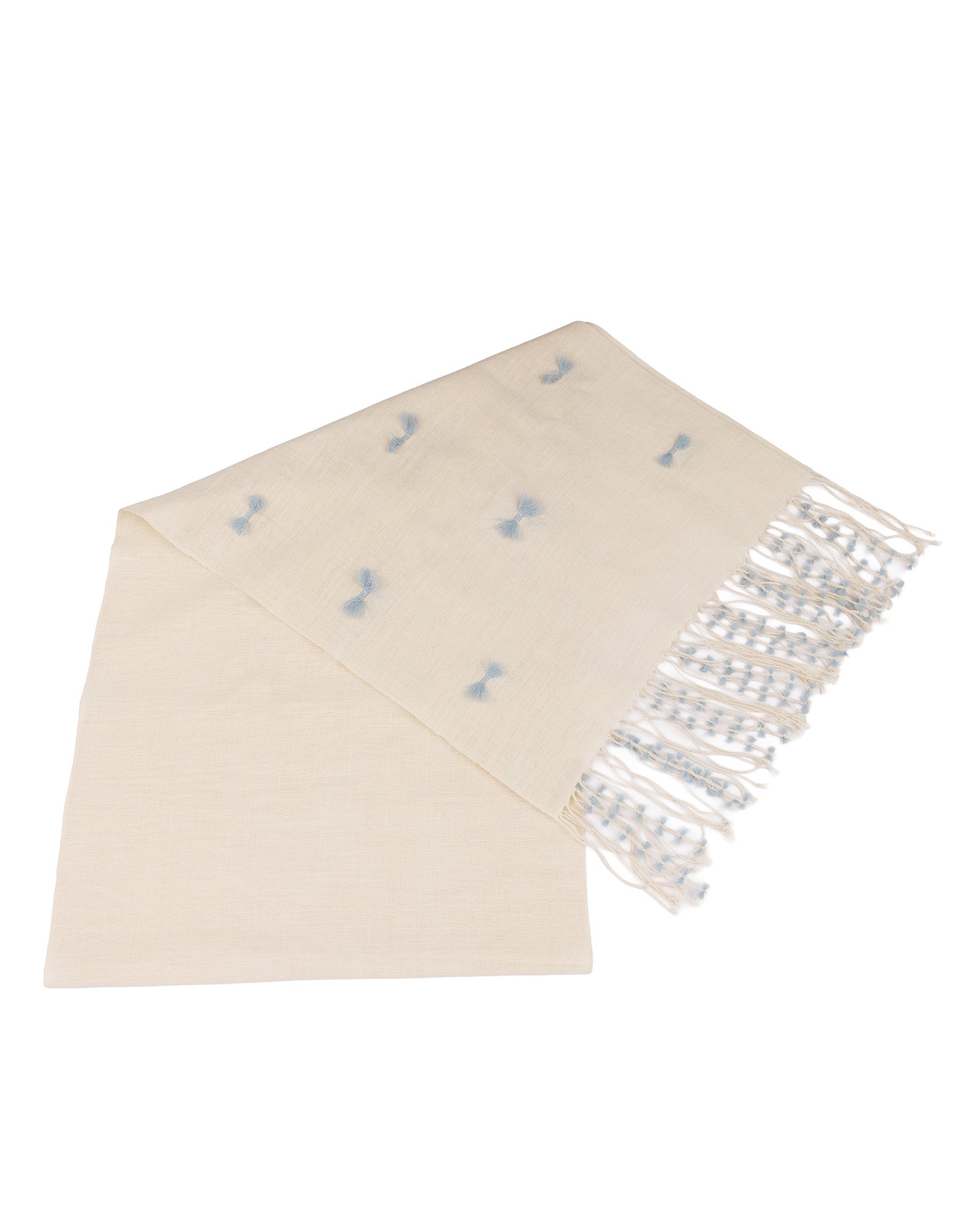Beige scarf with blue pattern and silver fringe on a white background