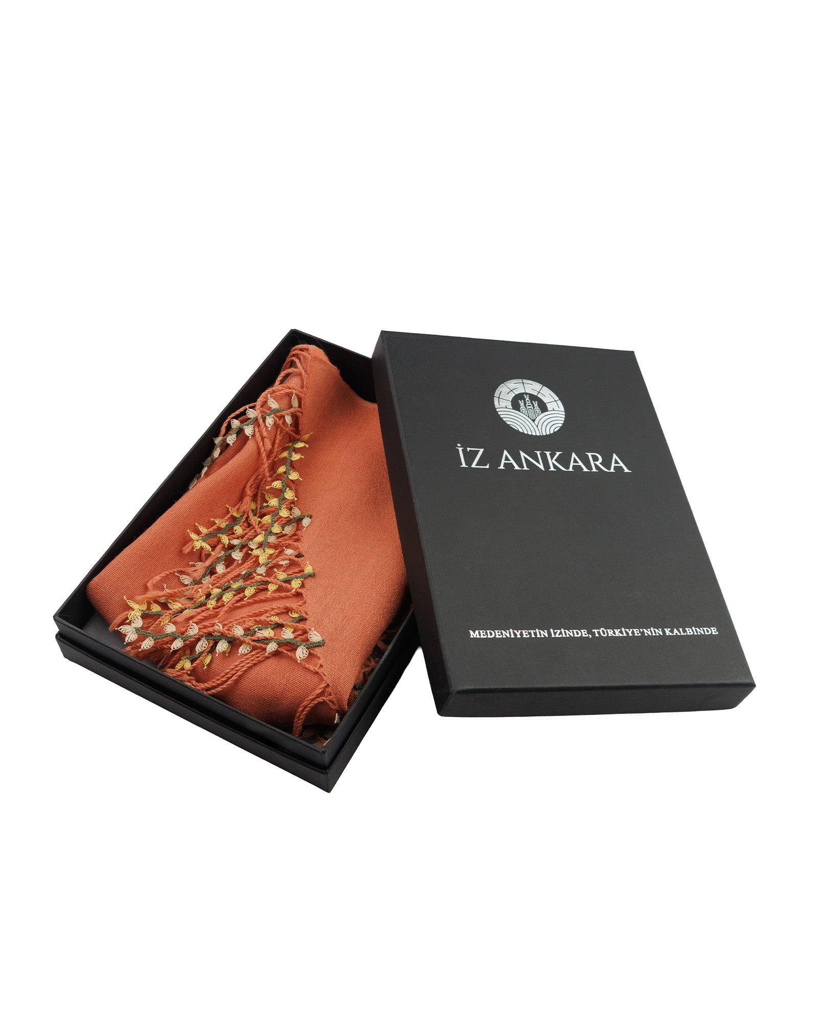 Orange scarf with gold fringe in a black 'IZ ANKARA' box on a white background
